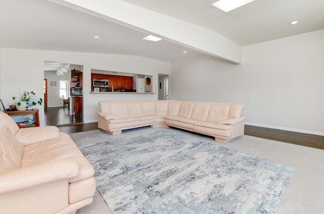 living area with vaulted ceiling with beams, baseboards, wood finished floors, and recessed lighting