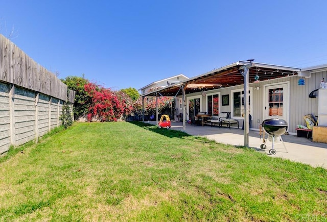 view of yard with a patio area and a fenced backyard