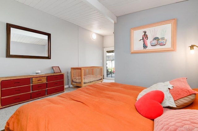 bedroom featuring carpet floors, wooden ceiling, and beamed ceiling