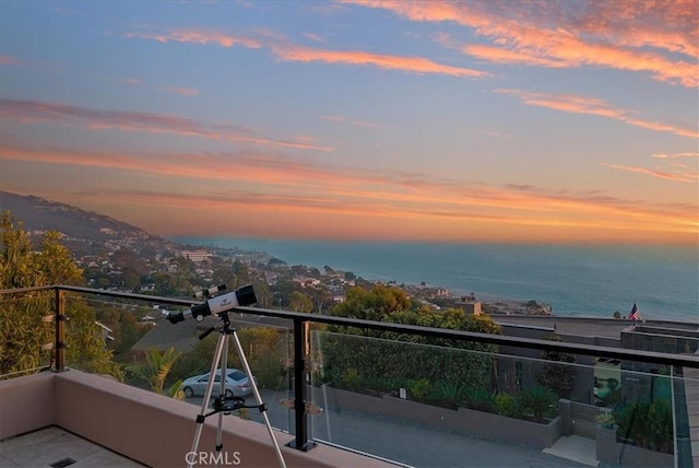 balcony at dusk with a water view