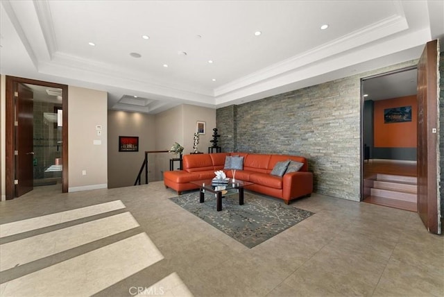 living area with a tray ceiling, crown molding, and recessed lighting