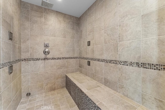 bathroom with tiled shower