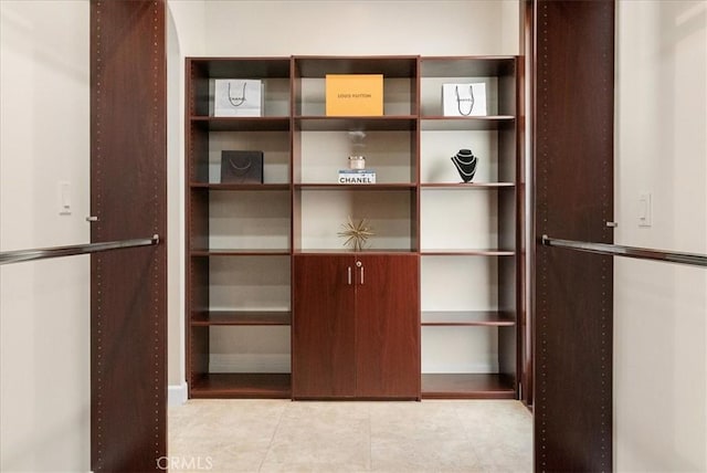 walk in closet featuring light tile patterned floors