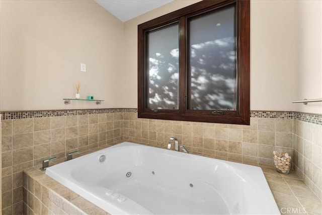 bathroom featuring a tub with jets