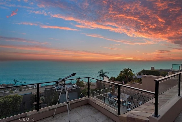 balcony featuring a water view