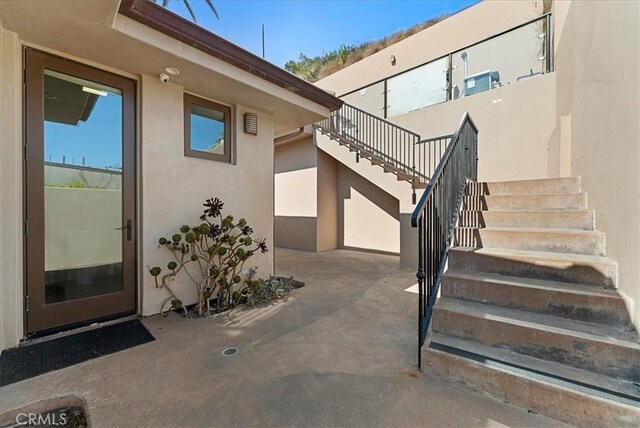 31422 Ceanothus Dr, Laguna Beach, CA 92651 - entrance to property with stucco siding, a patio, and a security system