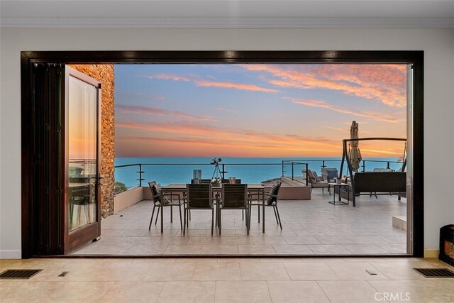 31422 Ceanothus Dr, Laguna Beach, CA 92651 - patio terrace at dusk featuring a water view, a balcony, and an outdoor living space
