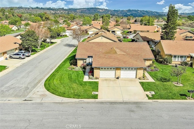 aerial view featuring a residential view and a mountain view