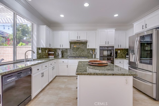 kitchen featuring ornamental molding, a sink, a kitchen island, and black appliances