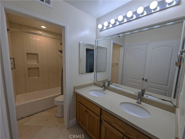 bathroom with shower / bath combination, a sink, toilet, and tile patterned floors