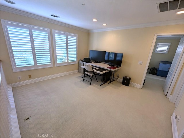 office area featuring baseboards, ornamental molding, visible vents, and light colored carpet