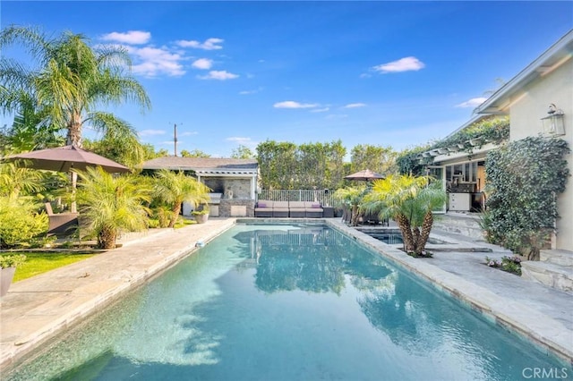 pool featuring a patio and fence