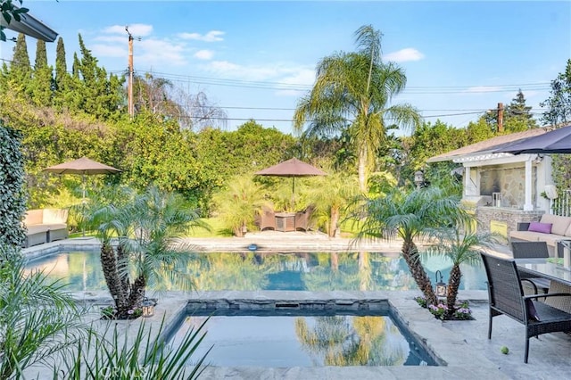 pool with a patio area