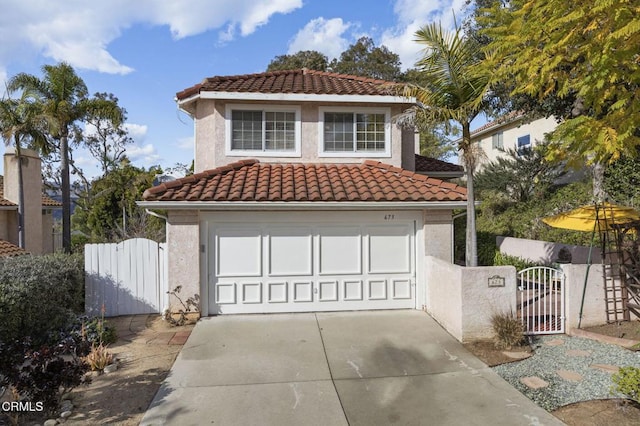 mediterranean / spanish-style home with a garage, a tiled roof, a gate, and stucco siding