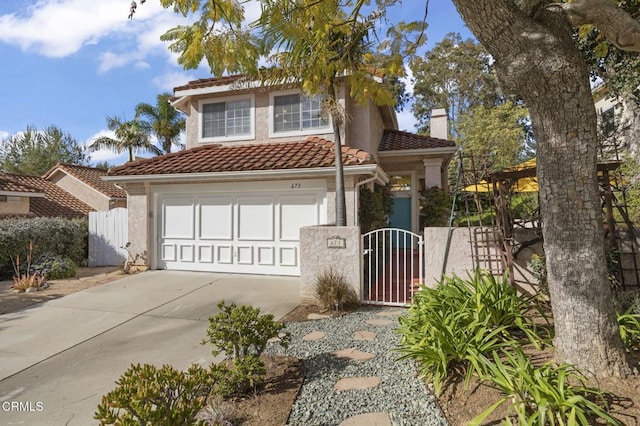 view of front of home with fence, a tiled roof, concrete driveway, a gate, and a chimney