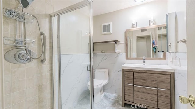 full bath featuring vanity, toilet, a marble finish shower, visible vents, and marble finish floor