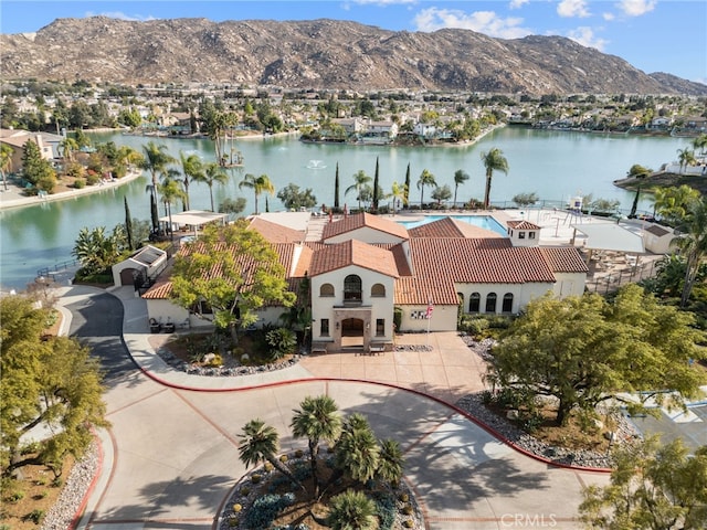 aerial view featuring a water and mountain view