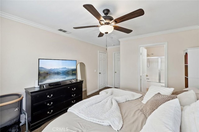 bedroom with ensuite bathroom, a ceiling fan, baseboards, visible vents, and crown molding