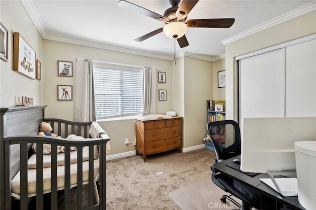 bedroom featuring light colored carpet, a ceiling fan, baseboards, a closet, and crown molding