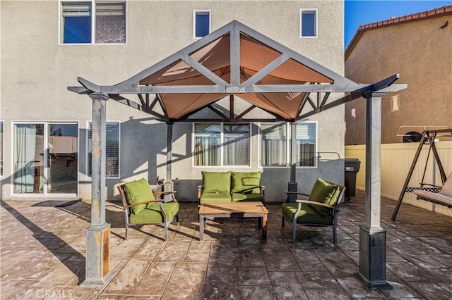 view of patio featuring fence, an outdoor hangout area, and a pergola