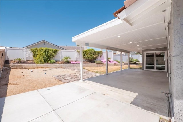 17875 Idyllwild Ln, Victorville, CA 92395 - view of patio featuring fence and an attached carport