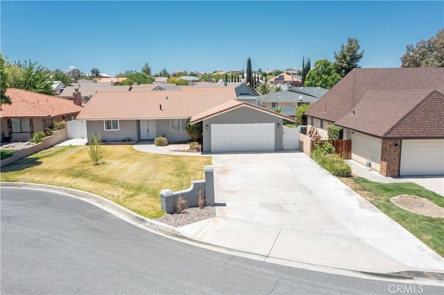 17875 Idyllwild Ln, Victorville, CA 92395 - ranch-style home with a residential view, stucco siding, and driveway