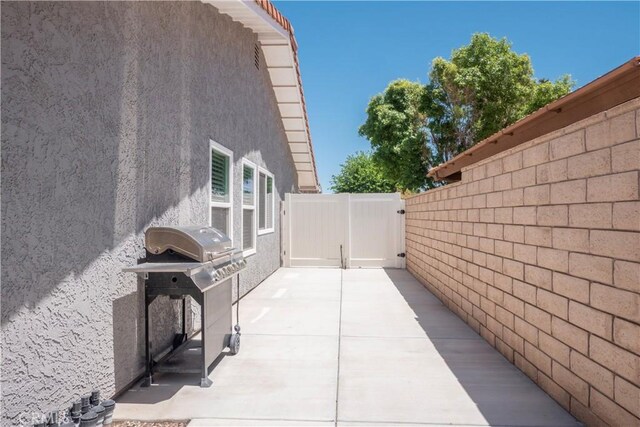 17875 Idyllwild Ln, Victorville, CA 92395 - view of patio / terrace with a grill and fence