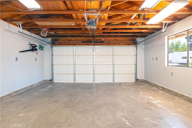 17875 Idyllwild Ln, Victorville, CA 92395 - garage with baseboards and a garage door opener