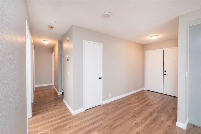 17875 Idyllwild Ln, Victorville, CA 92395 - corridor with light wood-style flooring and baseboards