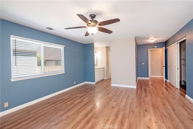 17875 Idyllwild Ln, Victorville, CA 92395 - unfurnished room with a ceiling fan, light wood-style floors, and baseboards