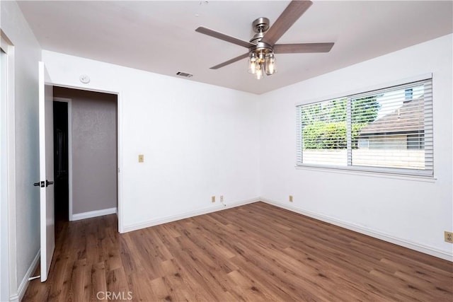 17875 Idyllwild Ln, Victorville, CA 92395 - unfurnished room with wood finished floors, a ceiling fan, and baseboards