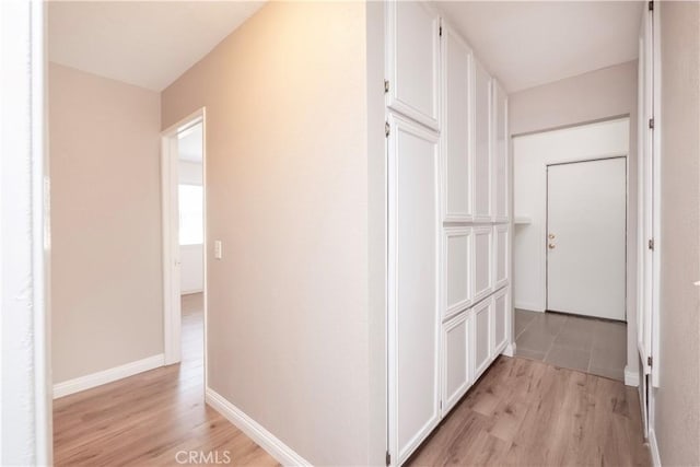 17875 Idyllwild Ln, Victorville, CA 92395 - corridor featuring light wood-style flooring and baseboards