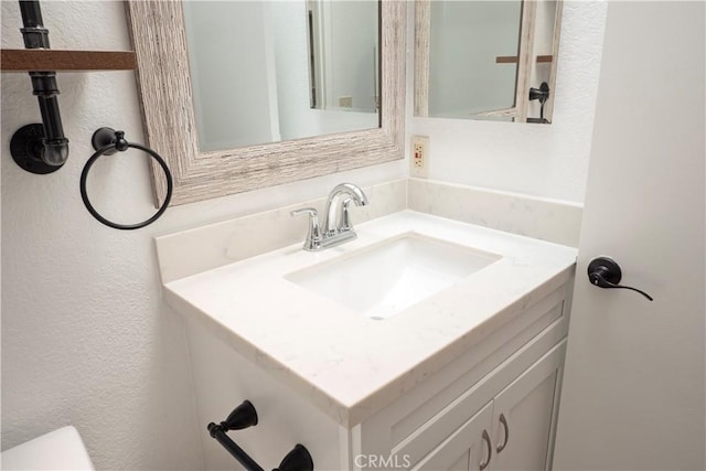 17875 Idyllwild Ln, Victorville, CA 92395 - half bath with a textured wall, vanity, and toilet