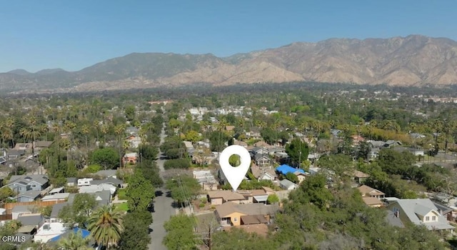 drone / aerial view featuring a residential view and a mountain view