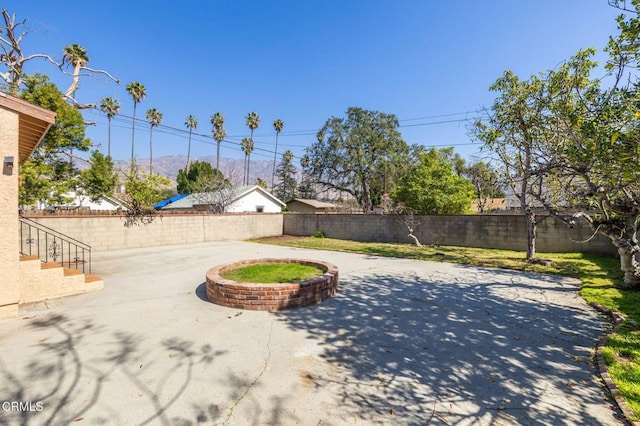 exterior space with a fenced backyard