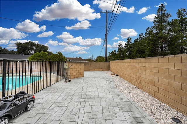 view of patio / terrace with a fenced in pool and a fenced backyard