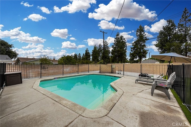 view of swimming pool with a fenced in pool, a fenced backyard, and a patio