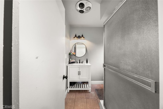 bathroom featuring baseboards and vanity