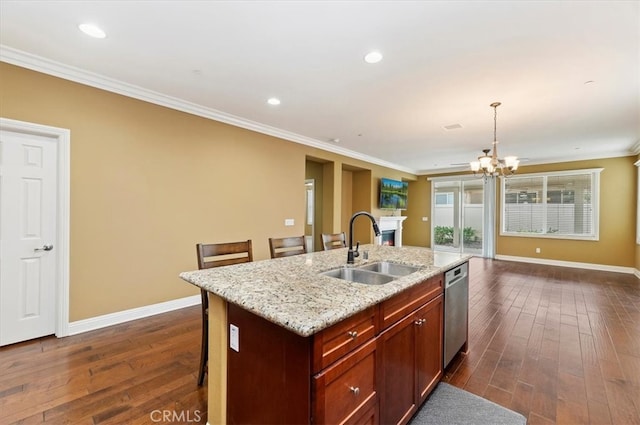 kitchen featuring baseboards, open floor plan, dark wood-type flooring, crown molding, and a sink