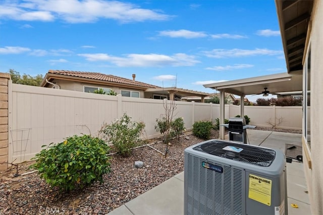 view of yard with a patio, a fenced backyard, and cooling unit