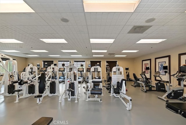 exercise room featuring a drop ceiling