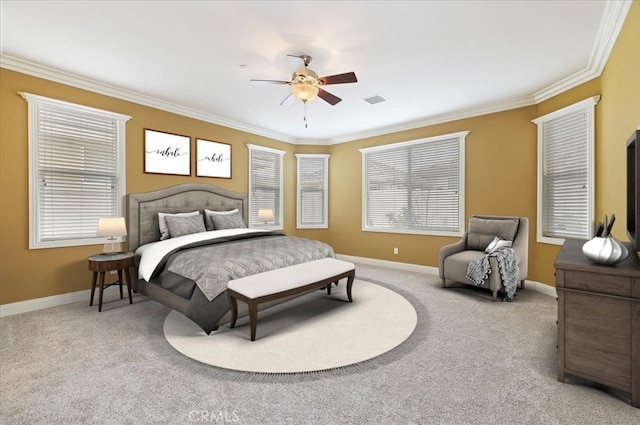 carpeted bedroom featuring baseboards, visible vents, and ornamental molding