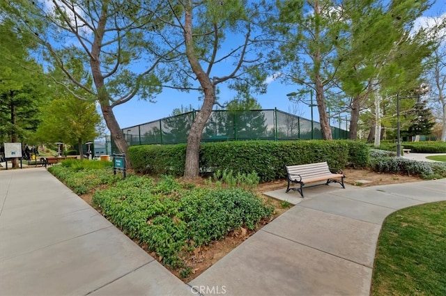 view of property's community featuring fence