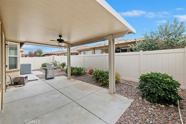 view of patio / terrace featuring a fenced backyard, a grill, and a ceiling fan