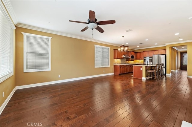 unfurnished living room featuring baseboards and dark wood finished floors