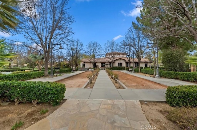 view of community featuring concrete driveway