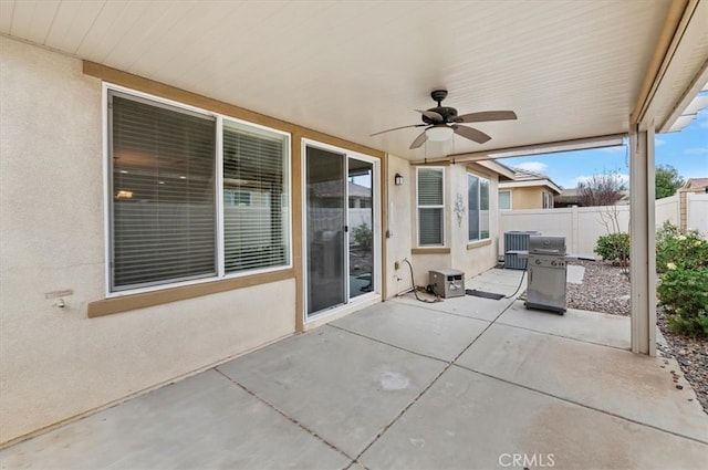 view of patio / terrace with fence and a ceiling fan