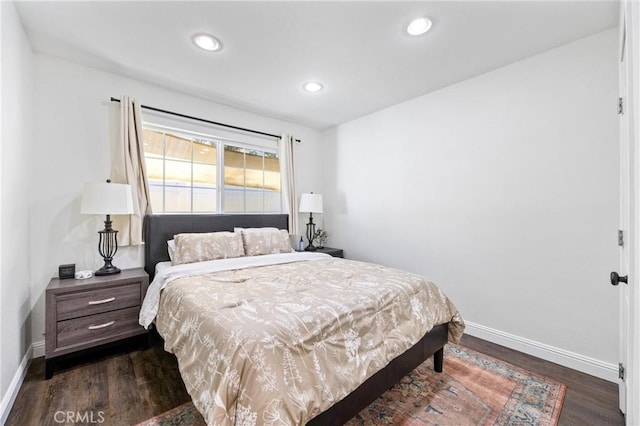 bedroom featuring baseboards, dark wood-style flooring, and recessed lighting