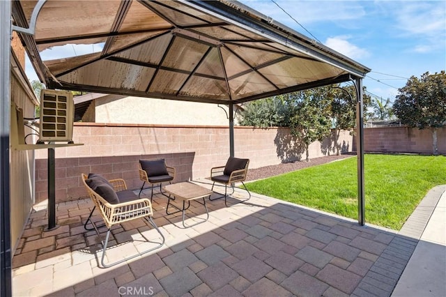 view of patio with a fenced backyard and a gazebo