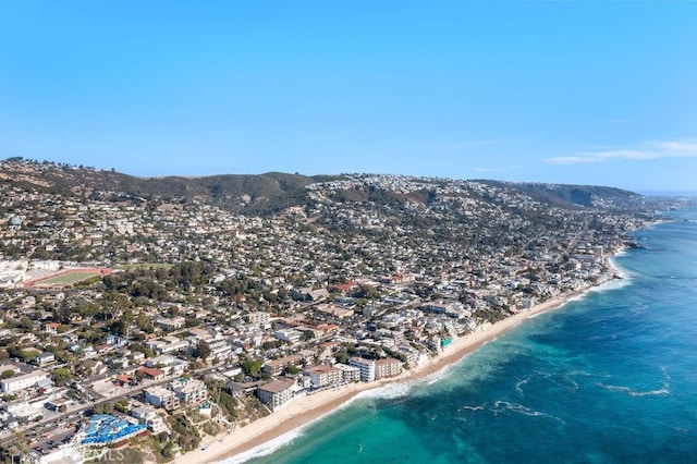 birds eye view of property featuring a view of the beach and a water view